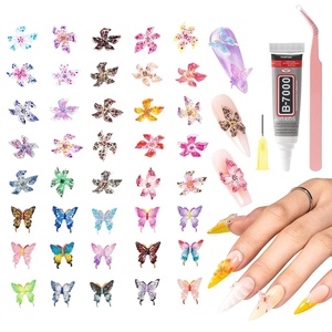 image:imageMelodySusie 100Pcs 3D Lily amp Butterfly MixedShape Nail Charms and Gems 20 Colors Flowers amp 15 Colors Butterfly Rhinestones with Tweezers for Nail Art Manicure Decorations and DIY Crafting